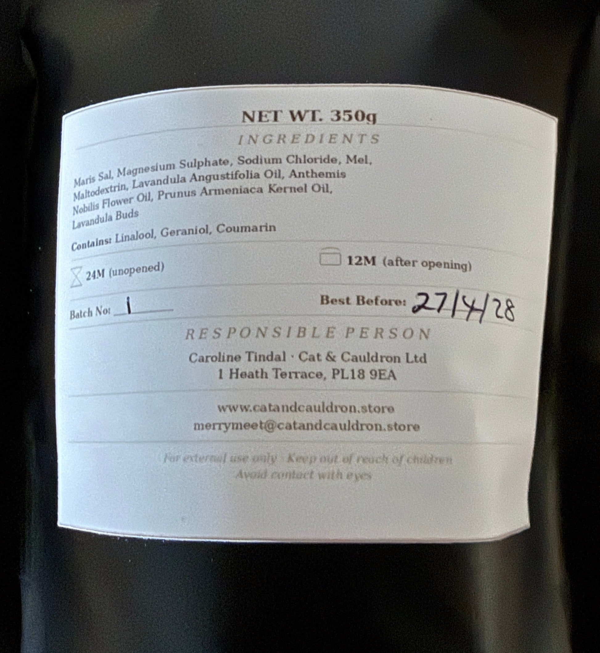 Back label of lavender bath salts listing ingredients and BB dates